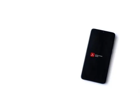 Adobe Acrobat Reader app launch screen with logo on the display of a black mo Stock Photos