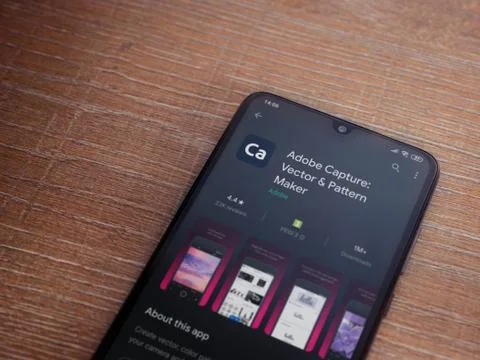 Adobe Capture - Vector and Pattern Maker app play store page on the display o Stock Photos