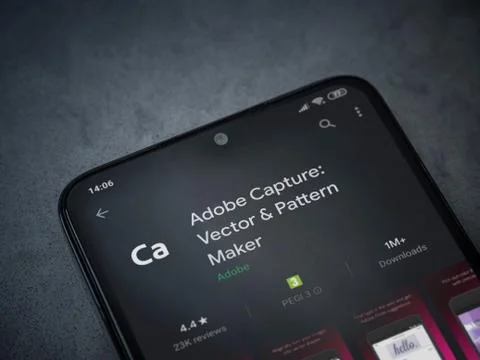 Adobe Capture - Vector and Pattern Maker app play store page on the display o Stock Photos