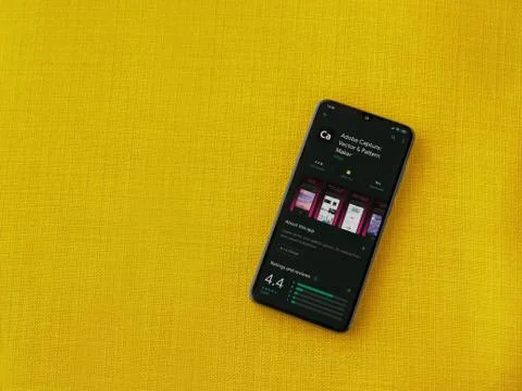 Adobe Capture - Vector and Pattern Maker app play store page on the display o Foto stock