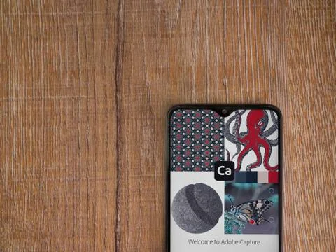 Adobe Capture - Vector and Pattern Maker app launch screen with logo on the d 스톡 사진