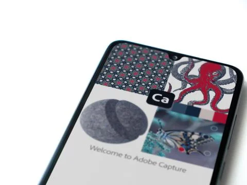 Adobe Capture - Vector &amp; Pattern Maker app launch screen with logo on the dis Stock Photos