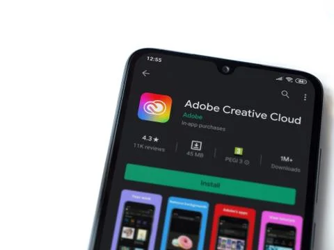 Adobe Creative Cloud app play store page on the display of a black mobile sma Foto stock