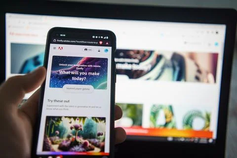 Adobe Firefly on PC and Smartphone screen Stock Photos