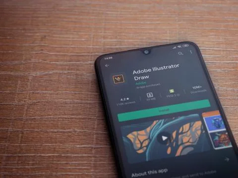 Adobe Illustrator Draw app play store page on the display of a black mobile s Stock Photos