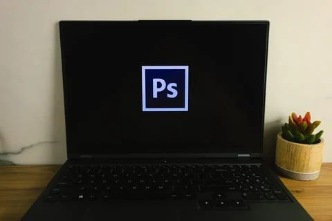 Adobe Photoshop graphics editor logo displayed on laptop Stock Photos
