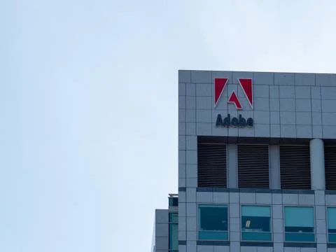 Adobe Systems, Photoshop maker, logo on headquarters skyscraper towers in Sil Stock Photos