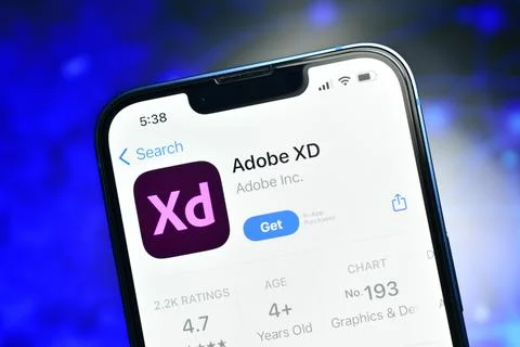 Adobe XD app on smartphone used to develop vector design on mac and pc Stock Photos