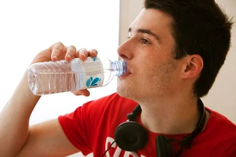 Adolescent with cold drink Stock Photos