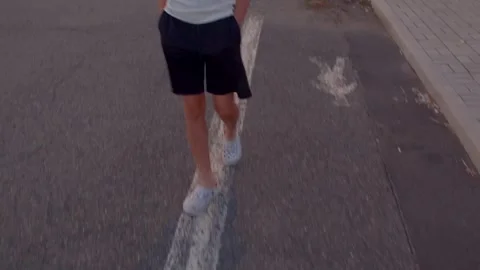 Adolescent confidently navigating urban environment with hands Stock Footage 320956552