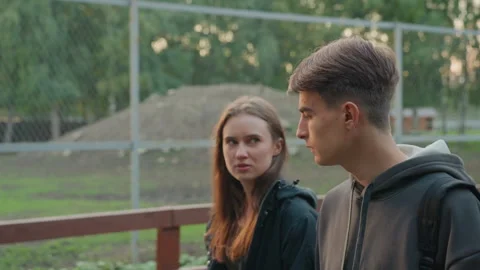 Adolescent peers reveal deep sentiments with quiet glances and gestures Stock Footage 329428484
