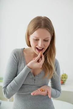 Adolescent snacking Stock Photos