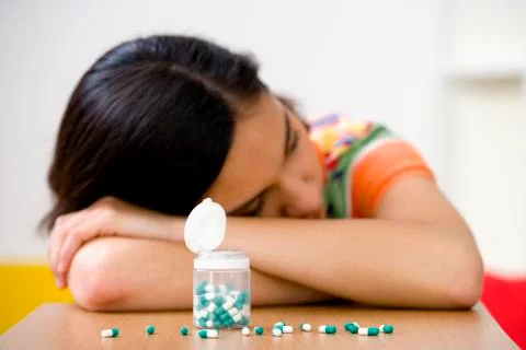 Adolescent taking medication Stock Photos