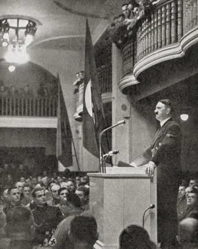 Adolf Hitler, seen here making a speech in the Buergerbraukeller, a beer hall in Stock Photos