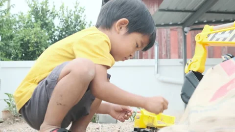 Adorable 4-5 year boy playing outdoor happy time Stock Footage 164583098