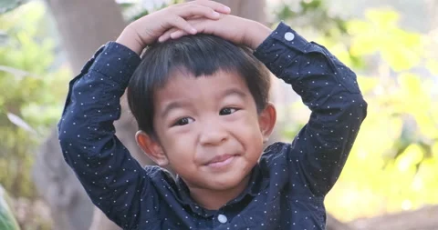 Adorable 4-5 year boy playing outdoor happy time nature forest Stock Footage 166510435