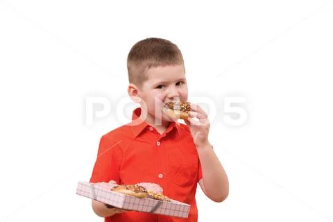 Adorable baby boy eat donut with chocolate Stock Photos