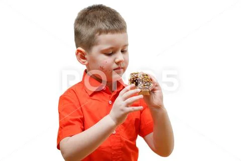 Adorable baby boy eat donut with chocolate Stock Photos