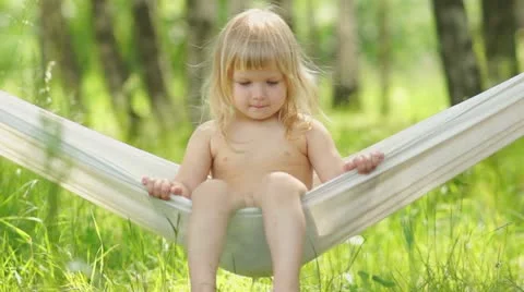 Adorable baby swing in hammock Stock Footage 11985391