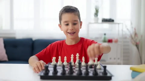 Adorable boy developing chess strategy, improving memory, critical thinking Stock Footage 224960521