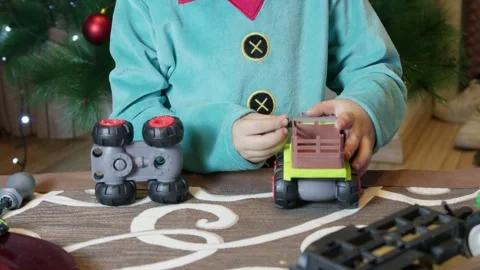 Adorable child boy dressed as elf making toys for children christmas presents. Stock Footage 285322553