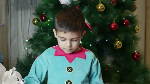 Adorable child boy dressed as elf making toys for children christmas presents. Stock Footage 285322579