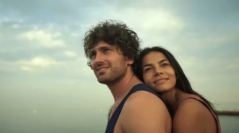 Adorable couple hugging on the beach Stock Footage 68800399