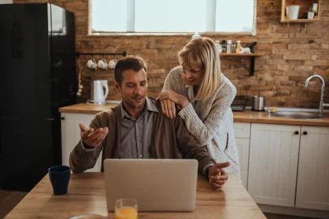 Adorable couple using technology Stock Photos