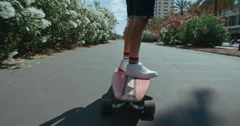 Adorable cute kid learn to ride longboard Stock Footage 249901138