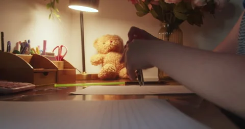 Adorable cute smart school age girl learning to write, doing math homework Stock Footage 296259193