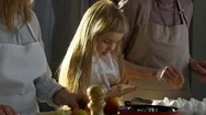 Adorable Girl Making Cookies With Grandma And Mother Stock Footage
