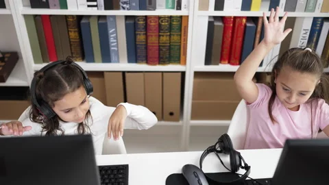 Adorable girls student using computer high five at classroom 스톡 동영상 237839666