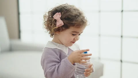 https://images.pond5.com/adorable-hispanic-girl-drinking-water-footage-230028517_iconl.jpeg