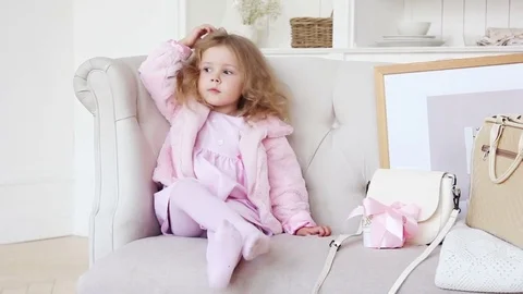 Adorable kid dressing up and styling Stock Footage 83178481