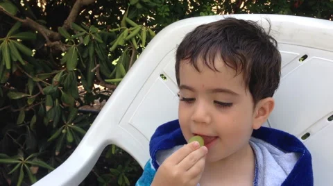 Adorable kid eating grape Stock Footage 41650769