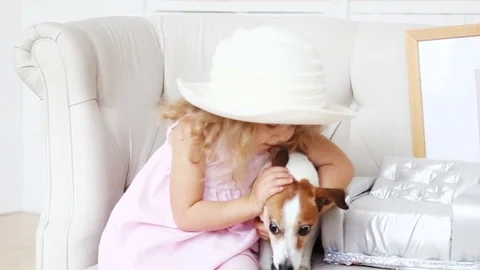 Adorable kid posing playfully with dog 動画素材 83177697