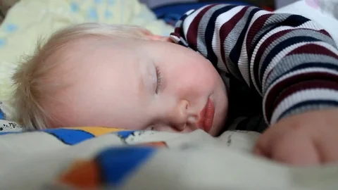 Adorable little boy sleeping in bed. A special filter that emphasizes a sleepy Stock-Footage 82278945