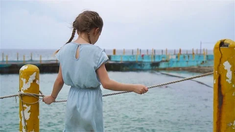 Adorable little girl at beach during sum... | Stock Video | Pond5