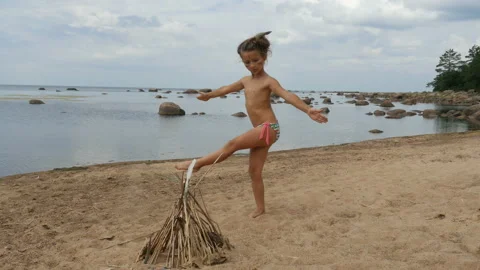 Adorable little girl dancing on the beach. Child dance Stock Footage 95335225