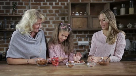 Adorable little girl sharing homemade cookies Stock Footage
