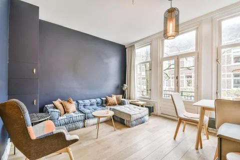 Adorable living room with low sofas Stock Photos