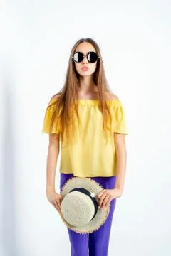 Adorable model posing in hat and casual clothes Stock Photos