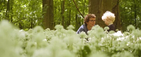 Adorable Mom and Son Bonding in the Middle of Lush Green Forest Stock Footage 133379092