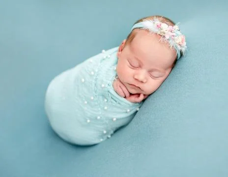 Adorable newborn wrapped Stock Photos