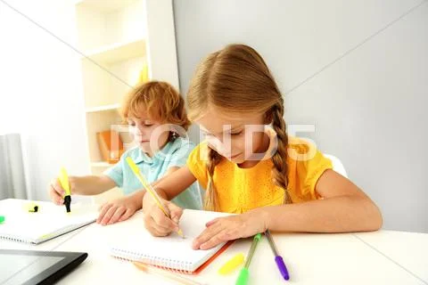Adorable pupils playing in kindergarten Stock Photos