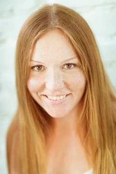 Adorable red-haired smiling young woman Stock Photos