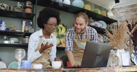 Adorable satisfied 30-aged purposeful multiracial sellers checking availability Stock Footage 143966084