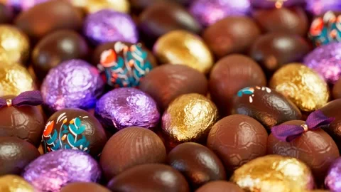 Adorable set of assorted chocolate Easter eggs. Shiny and colourful candies. Video stock 158246084
