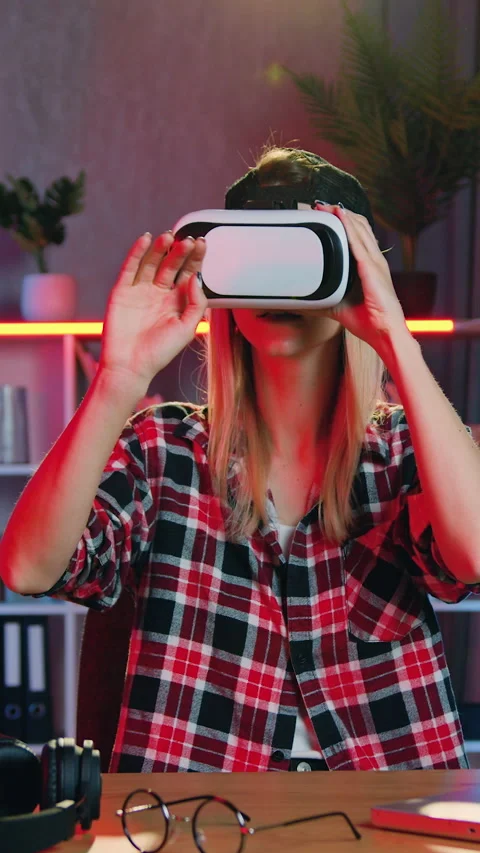 Adorable skilled in good mood 25-aged female worker in augmented reality goggles Stock Footage 329506693