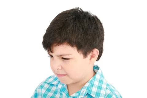 Adorable small boy looking at the viewer in a pensive mood. Stock Photos